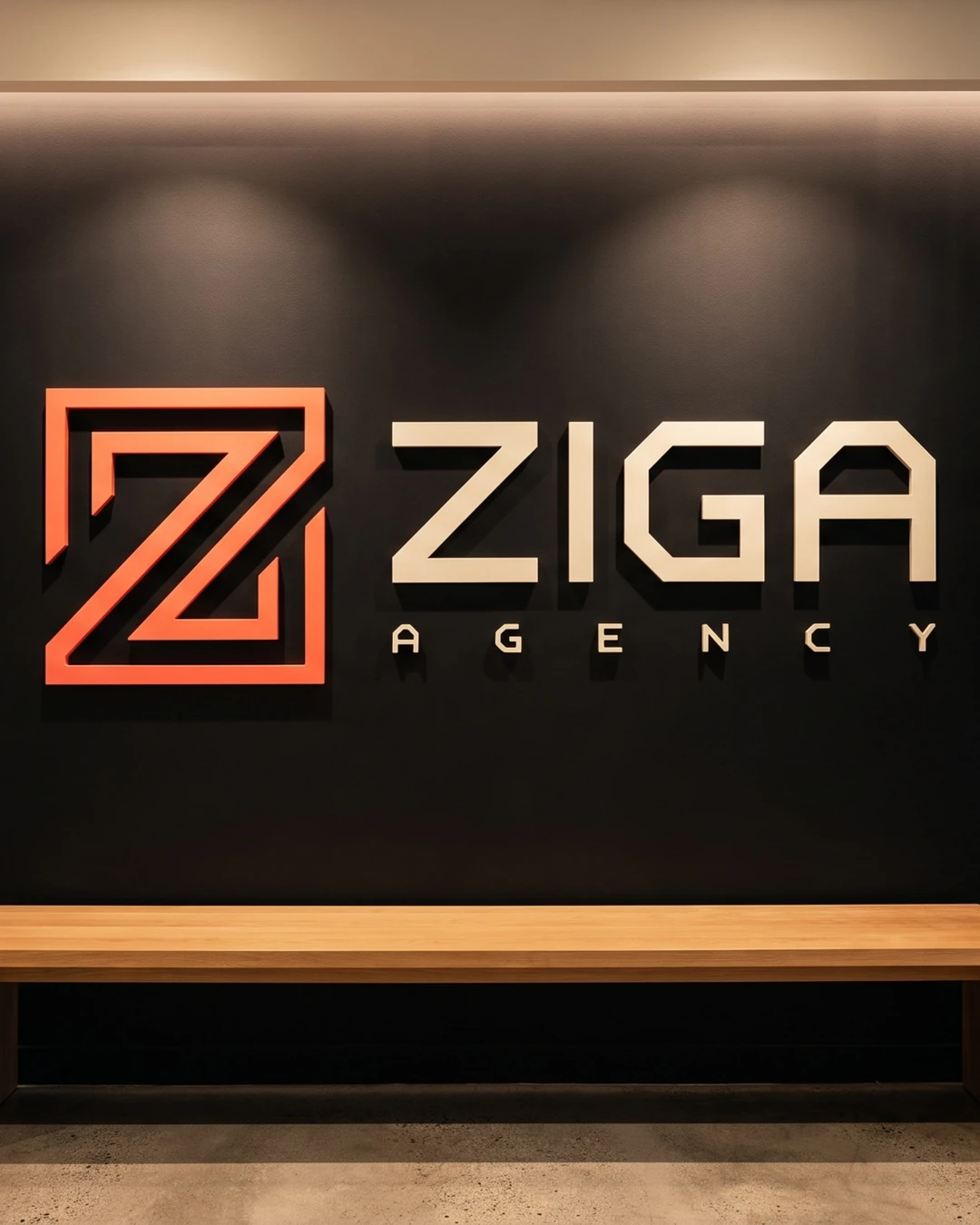 Logo da Ziga em letras caixa na parede preta da recepção